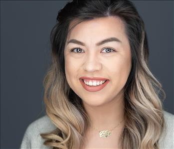 Woman smiling for a photo.