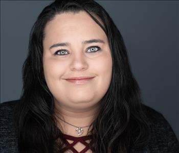 Woman smiling for a photo.