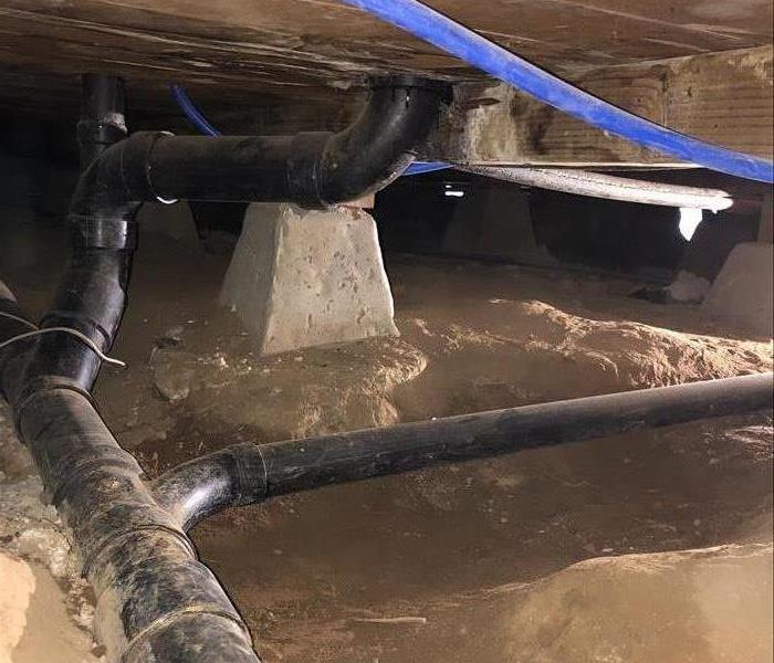 attic space with pipes and exposed wood