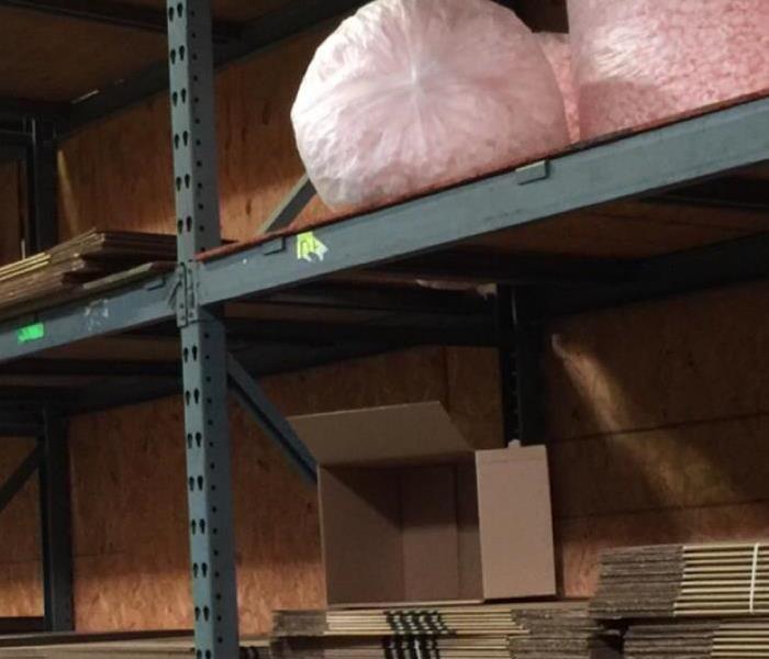 Stack of moving boxes in a warehouse.