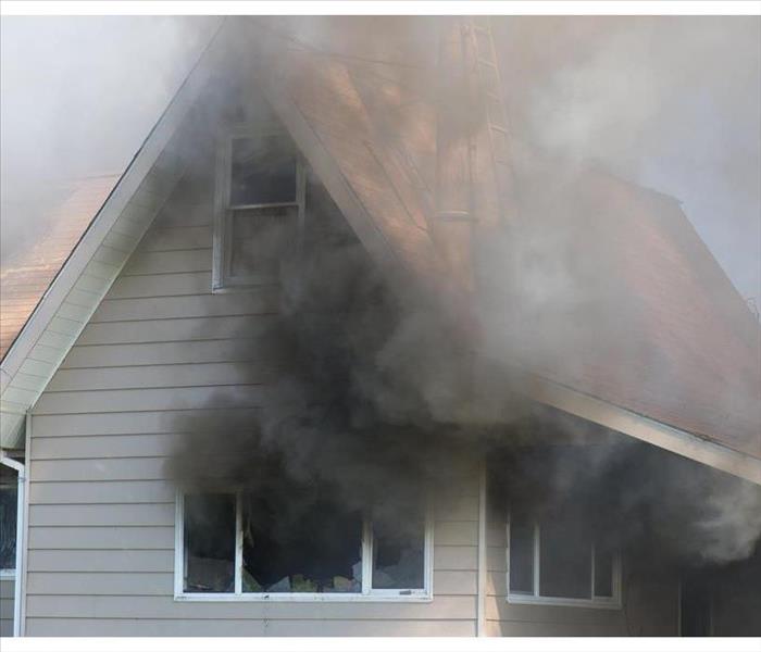 Thick smoke engulfs a home