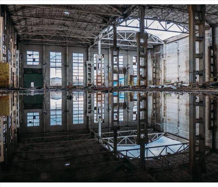 An empty building flooded by sewage water